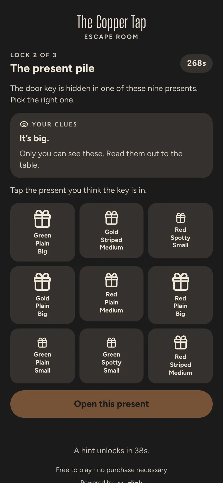 Escape Room in The Copper Tap’s charcoal and copper: a pile of nine presents, one hiding the key, with this phone’s clue.
